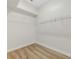 Spacious walk-in closet with shelving and new floors at 5103 Twin Creeks Dr, Valrico, FL 33596
