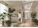Hallway leading to a luxurious bathroom featuring modern design and ample natural light at 555 Quay Cmn # 1801, Sarasota, FL 34236