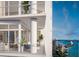 Modern balcony with stylish furniture, potted plants, and stunning city and water views at 555 Quay Cmn # 2004, Sarasota, FL 34236