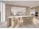 Spacious modern kitchen with stainless steel appliances, marble countertops, a waterfall island, and pendant lighting at 555 Quay Cmn # 2004, Sarasota, FL 34236
