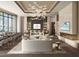 Elegant resident lounge featuring modern seating, a fireplace, a bar and decorative lighting at 555 Quay Cmn # 2004, Sarasota, FL 34236
