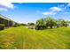 Expansive backyard showing a tranquil lake view adjacent to the homes in the community at 5609 Spanish Point Ct, Palmetto, FL 34221