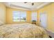 Bedroom featuring a window overlooking the lawn and a ceiling with crown molding at 5609 Spanish Point Ct, Palmetto, FL 34221