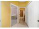 Hallway view of the Primary bedroom and bathroom at 5609 Spanish Point Ct, Palmetto, FL 34221