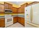 Well-maintained kitchen with ample cabinet space, standard appliances, and a functional layout at 5609 Spanish Point Ct, Palmetto, FL 34221