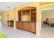Living room featuring built-in shelving and access to the bedroom at 5609 Spanish Point Ct, Palmetto, FL 34221