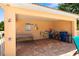 Poolside shelter area with showers, table, chairs, and pool floats for residents to use at 5609 Spanish Point Ct, Palmetto, FL 34221