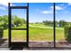 View of golf course and pond from screened in lanai at 5609 Spanish Point Ct, Palmetto, FL 34221
