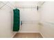 Organized walk-in closet with wire shelving and a hanging organizer for maximum storage at 5609 Spanish Point Ct, Palmetto, FL 34221