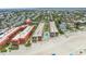 High angle aerial view shows community pool, tennis courts, and gulf access at 5806 Gulf Dr # 201, Holmes Beach, FL 34217