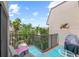Relaxing balcony with seating offers a pleasant outdoor space and a view of the surrounding trees at 5806 Gulf Dr # 201, Holmes Beach, FL 34217
