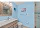 Updated bathroom featuring a modern vanity, sleek fixtures, and coastal decor, creating a relaxing atmosphere at 5806 Gulf Dr # 201, Holmes Beach, FL 34217