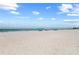 Wide sandy beach with clear skies at 5806 Gulf Dr # 201, Holmes Beach, FL 34217
