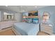Comfortable bedroom featuring a serene color scheme, stylish furnishings, and coastal-themed decor at 5806 Gulf Dr # 201, Holmes Beach, FL 34217