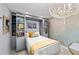 Multi-purpose bedroom with built-in bookshelves, pull-down bed and a dining room area at 5806 Gulf Dr # 201, Holmes Beach, FL 34217