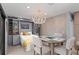 Multi-purpose bedroom with built-in bookshelves, pull-down bed and a dining room area at 5806 Gulf Dr # 201, Holmes Beach, FL 34217