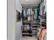 Walk-in closet with ample storage, custom shelving, and rods for organized clothing and accessories at 5806 Gulf Dr # 201, Holmes Beach, FL 34217