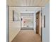 Hallway featuring beach-themed decor, a display case, and an elevator for convenient access at 5806 Gulf Dr # 201, Holmes Beach, FL 34217