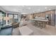 Open concept kitchen with island seating and adjacent Gathering room at 5806 Gulf Dr # 201, Holmes Beach, FL 34217