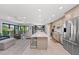 Spacious kitchen with island seating open to the Gathering room and balcony beyond at 5806 Gulf Dr # 201, Holmes Beach, FL 34217