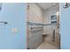 Walk-in shower with elegant tile work, glass door, and built-in shelving for added convenience and style at 5806 Gulf Dr # 201, Holmes Beach, FL 34217