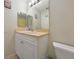 Bathroom with a single sink vanity and a large mirror above the sink at 590 Ridgewood Nw St, Port Charlotte, FL 33952