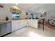 Functional kitchen with stainless steel appliances, tile flooring, and a breakfast bar at 590 Ridgewood Nw St, Port Charlotte, FL 33952