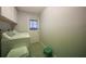 Laundry room equipped with a washer and dryer; door to outside at 590 Ridgewood Nw St, Port Charlotte, FL 33952
