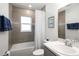 Well-lit bathroom with modern tiles, bathtub, shower, and a stylish vanity with ample counter space at 5958 164Th E Ave, Parrish, FL 34219
