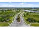 Aerial view of the neighborhood entrance on a sunny day at 5958 164Th E Ave, Parrish, FL 34219