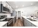 Contemporary kitchen with stainless steel appliances, sleek counters, and open design at 5958 164Th E Ave, Parrish, FL 34219