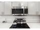 This modern kitchen includes stainless steel appliances, sleek countertops, and updated features at 5958 164Th E Ave, Parrish, FL 34219