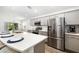 Kitchen featuring stainless steel appliances and sleek white counters, offering style and functionality at 5958 164Th E Ave, Parrish, FL 34219