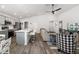 Open-concept living space with a modern kitchen, a comfortable living room, and stylish flooring, perfect for entertaining at 5958 164Th E Ave, Parrish, FL 34219