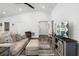Spacious living room featuring vaulted ceilings, modern furnishings, and stylish decor, ideal for comfortable living at 5958 164Th E Ave, Parrish, FL 34219