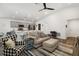 Inviting open-concept living room featuring modern furnishings and a seamless flow to the kitchen at 5958 164Th E Ave, Parrish, FL 34219