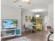 Living room with kitchen access and breakfast table. Natural light at 5981 Jim Davis Rd, Parrish, FL 34219