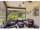 Relax on the patio with beautiful garden views in the comfort of cushioned seating at 5981 Jim Davis Rd, Parrish, FL 34219