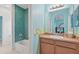 bathroom features themed wall art, updated finishes and tiled shower/bath at 6306 Anise Dr, Sarasota, FL 34238