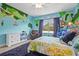 Charming bedroom featuring a unique world map mural and a cozy hanging chair at 6306 Anise Dr, Sarasota, FL 34238