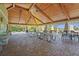 A covered community space with picnic tables, chairs, stone countertops, and a view of the pool at 6306 Anise Dr, Sarasota, FL 34238