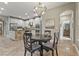 Open-concept, eat-in dining space features white cabinets and stainless appliances at 6306 Anise Dr, Sarasota, FL 34238