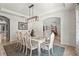 Well-lit formal dining area with modern chandelier, wainscotting, and lots of space at 6306 Anise Dr, Sarasota, FL 34238