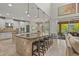 Modern kitchen with a large island, pendant lighting, and stainless steel appliances at 6306 Anise Dr, Sarasota, FL 34238