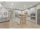 A chef's kitchen boasting a center island, stainless appliances, and custom cabinets at 6306 Anise Dr, Sarasota, FL 34238