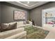 The large living room has a glass coffee table, a decorative rug, and access to the bonus room at 6306 Anise Dr, Sarasota, FL 34238
