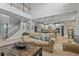 Inviting living area with an open floor plan, staircase, and kitchen access at 6306 Anise Dr, Sarasota, FL 34238