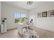 Bright office space featuring a large window, desk, and wood-look flooring at 6306 Anise Dr, Sarasota, FL 34238