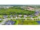 A neighborhood street view with well-manicured lawns and beautiful homes at 6306 Anise Dr, Sarasota, FL 34238