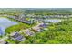 Homes are settled beside a picturesque lake, complete with landscaped lawns and water views at 6306 Anise Dr, Sarasota, FL 34238